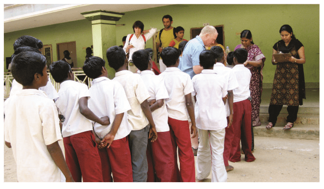 Children waiting to receive their tablet